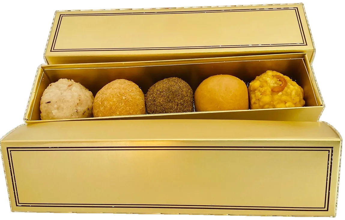 Gold gift box of homemade Telangana laddus for vayanam and festivals